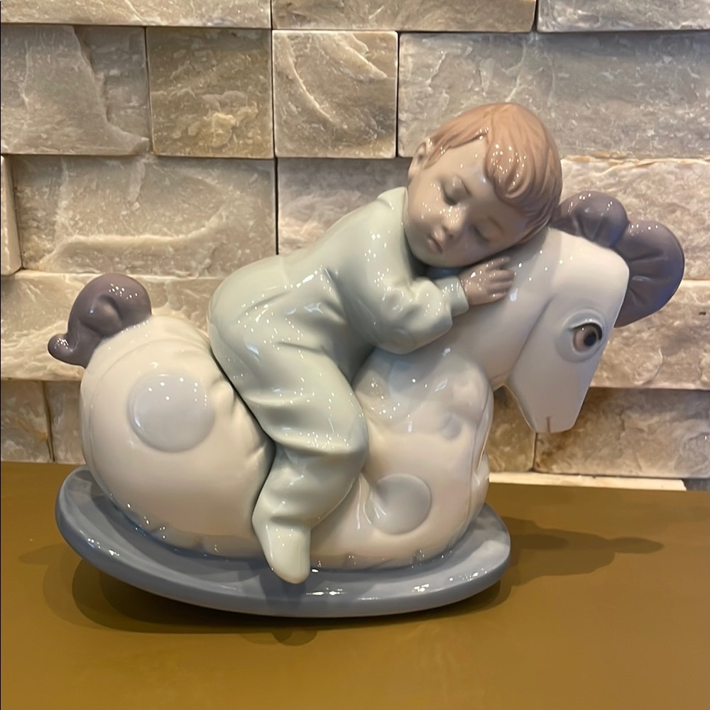 Porcelain NAO Sleeping Child on Rocking Horse Figurine